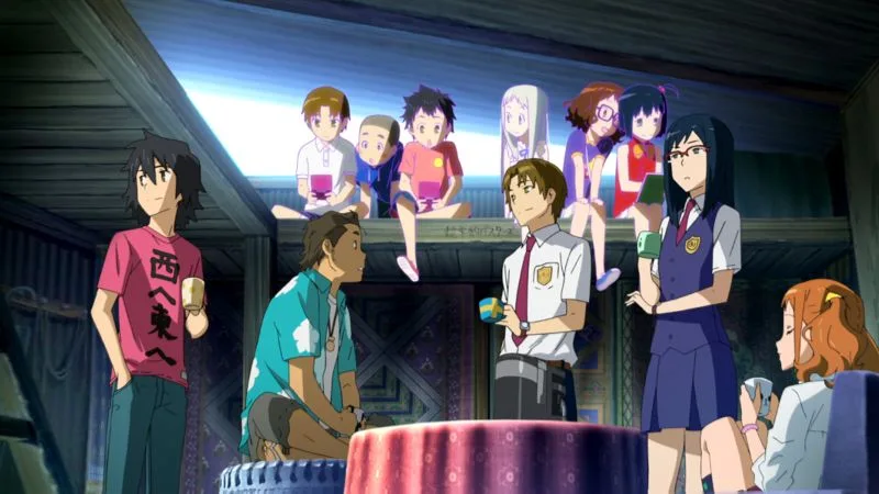 A group of six teenage friends are gathered in a wooden attic or secret base. The room is dimly lit, with light coming from a high window. On the left, a boy with black hair and a red t-shirt stands looking away. In the center, another boy in a green shirt sits, and a third boy in a white button-down shirt sits next to him. On the right, a girl with glasses and a blue dress sits, and another girl with glasses and a purple top stands nearby. A third girl in a white dress is visible as a translucent figure in the background. Behind the main group, the same six characters are depicted as young children sitting in a line. The overall mood is nostalgic and slightly somber, reflecting the anime's themes of childhood friendship and loss.