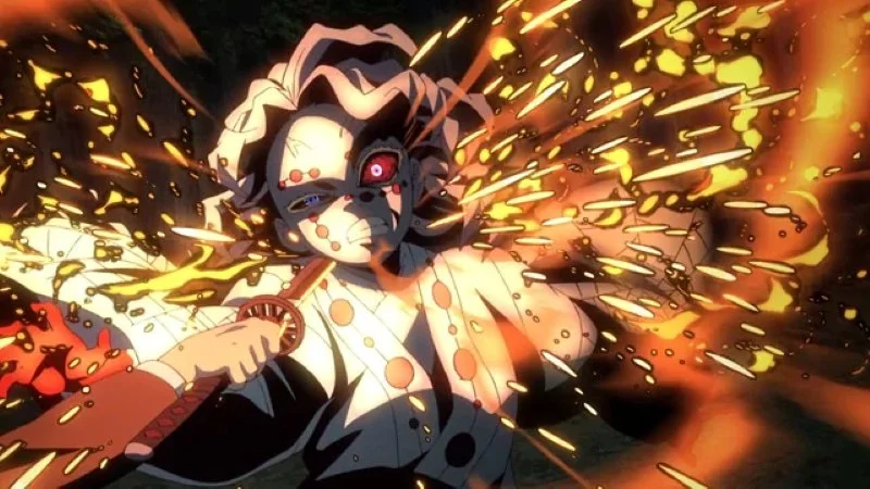 n action shot from the anime Demon Slayer: Kimetsu no Yaiba, featuring the character Tanjiro Kamado in the midst of battle against Rui, unleashing his "Hinokami Kagura" technique, which is represented by intense, bright orange and yellow fire effects and sparks exploding around him. 
