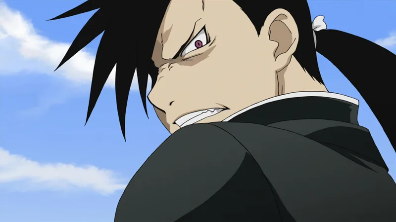 An image of the character Ling Yao, also known as Greed, from the anime series Fullmetal Alchemist: Brotherhood. The character is seen from a close-up, over-the-shoulder perspective, with an angry, determined expression on his face, looking back toward the viewer.