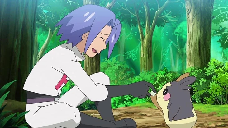 James from Team Rocket smiling and gently touching the nose of the Pokémon Morpeko in a forest setting.