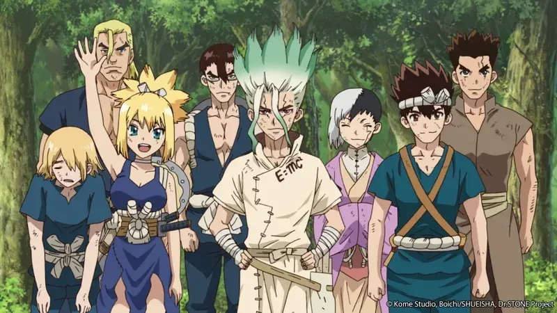 A group of eight anime characters from the series Dr. Stone are standing together in a forest clearing. In the center is the main protagonist, Senku Ishigami, a teenage boy with spiky green and white hair, wearing a torn white lab coat with "E=MC" written on it. To his left is Kohaku, a blonde girl in a blue dress, and to her left is a tall, muscular man named Taiju Oki. Other characters, including a man with a scar over one eye and a person with short black and white hair, surround Senku. The characters appear to be posing for a group photo, with the background consisting of green trees and foliage.