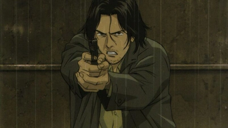 A man with dark, shoulder-length hair and a determined, intense expression points a handgun directly at the viewer. He is wearing a grey jacket over a light-colored shirt, and the scene appears to be outdoors in the rain or viewed through a rain-streaked window. The character is likely Dr. Kenzo Tenma from the anime series Monster.