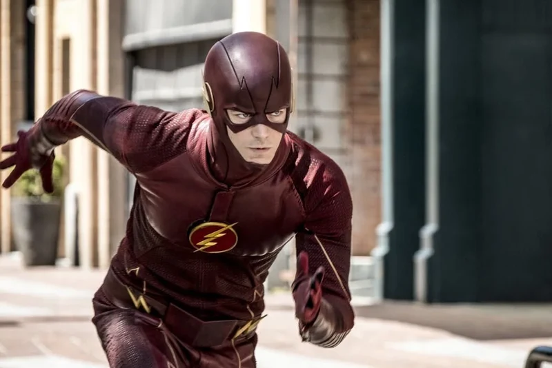 Barry Allen as The Flash in his superhero suit, running in an urban environment.