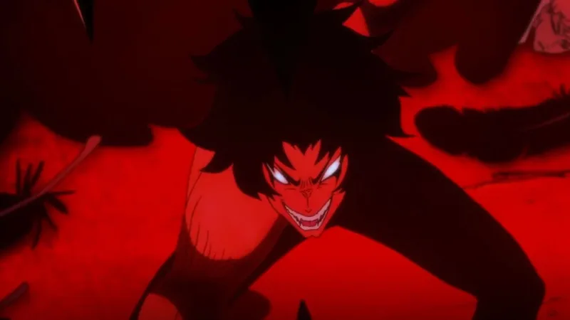 A close-up shot of Akira Fudo from Devilman Crybaby in his demon form, set against an intense, saturated red background. He has a fierce, menacing grin showing sharp fangs, glowing white eyes, and wild, dark hair. Dark, shadowy spikes frame the top and bottom of the character.