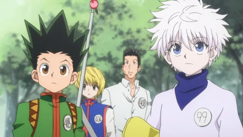Four young characters from the anime Hunter x Hunter standing outdoors during the Hunter Exam arc". Main Characters: The image prominently features the main protagonists: Gon Freecss (left, spiky black and green hair, green outfit, badge #405). Killua Zoldyck (right, spiky white hair, white and purple outfit, badge #99). Kurapika (center-back, blond hair, blue outfit, badge #404) and Leorio Paradinight (center-back, dark hair, white suit, badge #408) are partially visible behind Gon and Killua. Context: The scene is from the initial "Hunter Exam" arc of the series, where the characters meet and form a friendship while undertaking a rigorous exam to become licensed Hunters. The setting appears to be a forested path or park area.