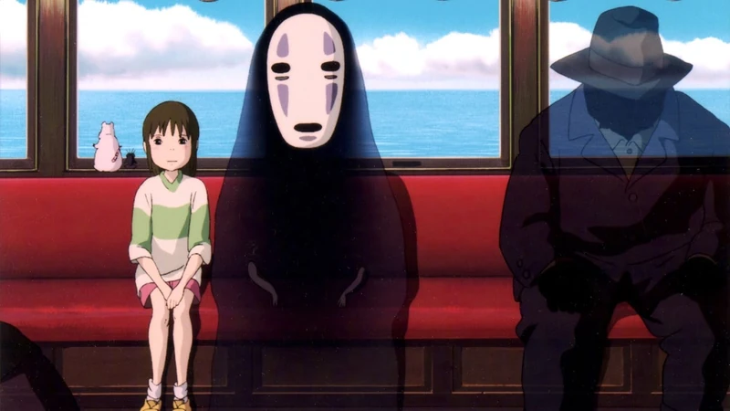 This image displays a scene from the Studio Ghibli film Spirited Away, featuring several key characters in a train car. Characters: The image prominently shows the main character, Chihiro, sitting next to the spirit known as No-Face. A shadowy figure of a man in a suit and hat sits on the right. Setting: The characters are seated on a red bench inside a train car. Background: The windows show a clear blue ocean and sky, suggesting the train is traveling over water. A small pink cat figurine is visible on the bench to the left of Chihiro.