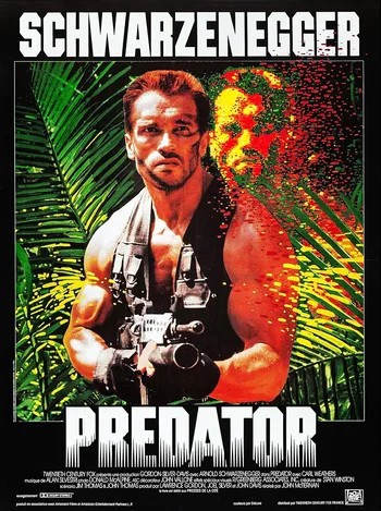A movie poster for the film Predator. The main image features actor Arnold Schwarzenegger as the character Dutch, muscular and holding a rifle, standing in a dense jungle environment. To his right, a second, dissolving image of his face appears in red and yellow hues, representing the Predator's heat vision or camouflage effect. 