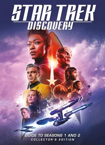 The image is the cover of the book Star Trek Discovery: Guide to Seasons 1 and 2 Collector's Edition. The cover features a collage of main characters from the television series, set against a backdrop of space and a prominent Starfleet insignia. Key characters visible include Sonequa Martin-Green as Michael Burnham, Doug Jones as Saru, and Anson Mount as Captain Christopher Pike. At the bottom of the cover, two Starfleet starships are depicted in flight. 