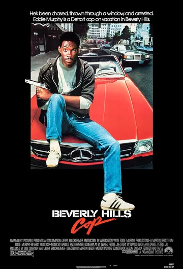 This image features Eddie Murphy in the iconic poster for the 1984 action-comedy film Beverly Hills Cop.