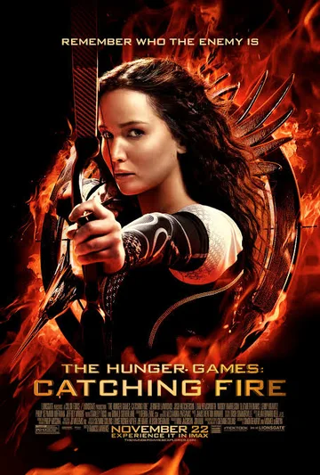 The poster shows the film The Hunger Games: Catching Fire, which is the second installment in the highly successful Hunger Games film franchise. Released theatrically in November 2013, the movie is based on the bestselling dystopian young adult novel Catching Fire by author Suzanne Collins
