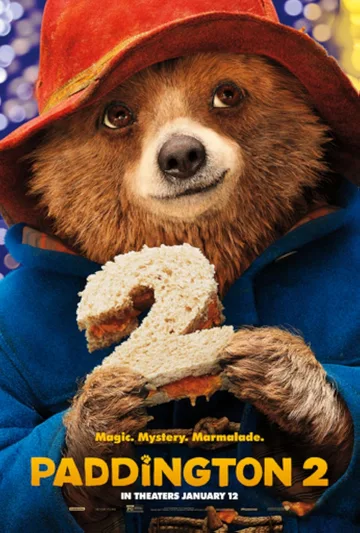 The image shows the official promotional poster for the 2017 comedy-adventure film Paddington 2, featuring the beloved bear holding a marmalade sandwich shaped like the number two.
