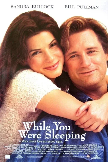 The image is the movie poster for the 1995 romantic comedy While You Were Sleeping, starring Sandra Bullock and Bill Pullman.